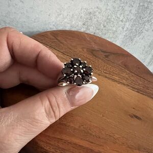 Garnet and Silver Ring with Intricate Detailing